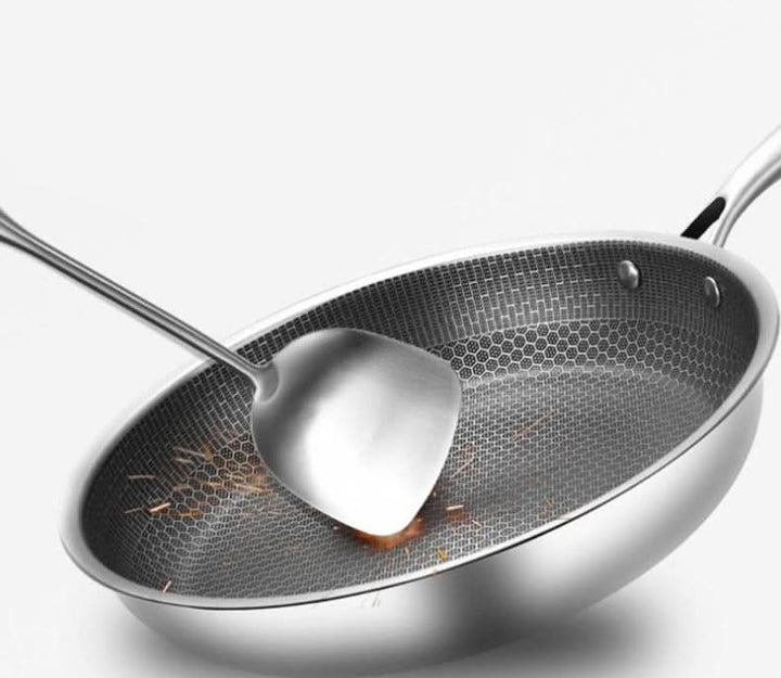 Sleek stainless steel non-stick frying pan, engineered for durability and effortless cooking, a kitchen essential.