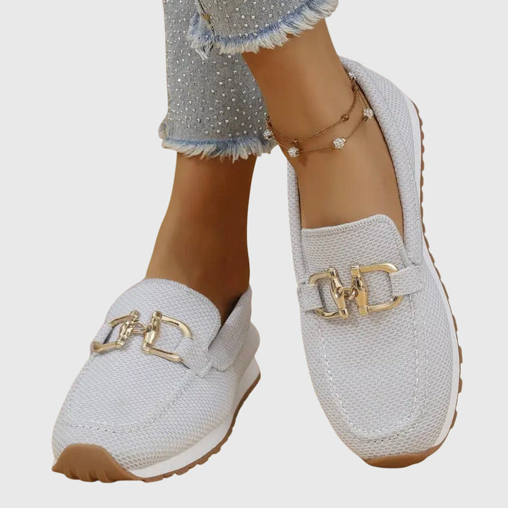 Women's dusty blue slip-on horsebit loafers. Stylish and comfortable everyday flats with a cushioned sole.