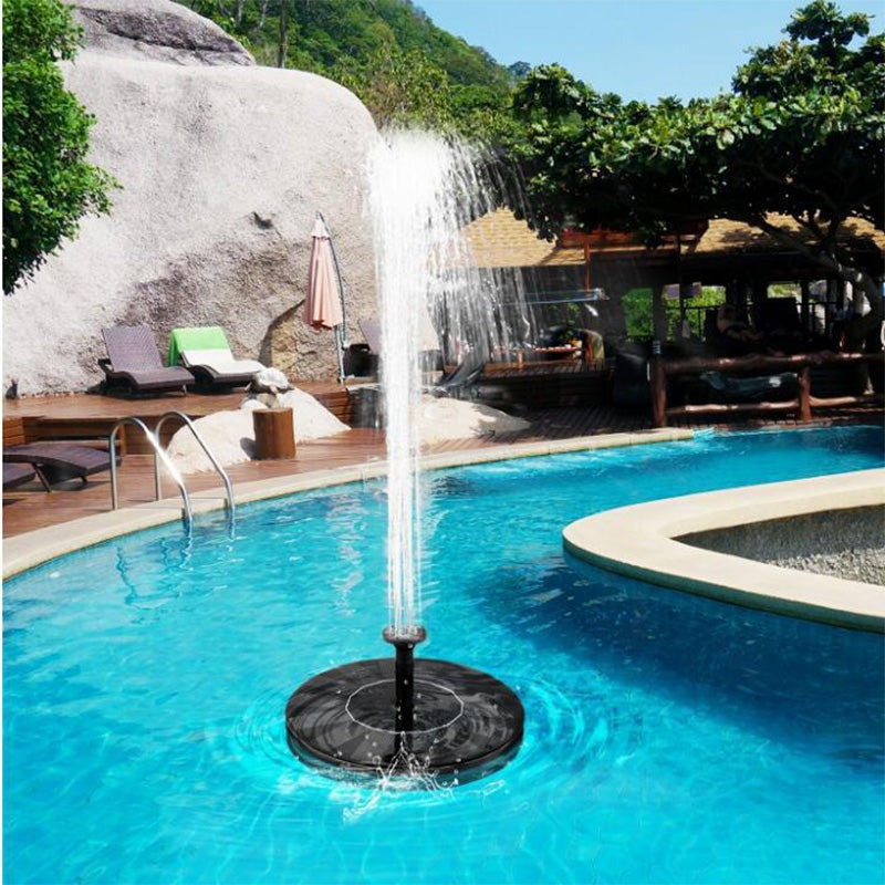 Eco-friendly floating solar fountain pump for bird baths & garden ponds, creating a relaxing water feature & decor.