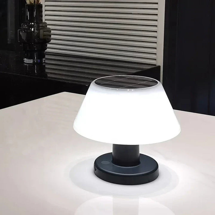 EcoGlow solar table lamp in a cozy setting. Wireless LED light, perfect for evening outdoor dining or indoor reading.