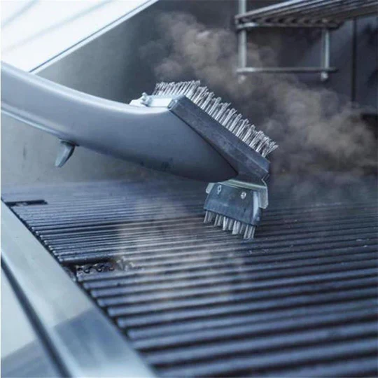 Barbecue steam cleaning brush, a powerful kitchen gadget for spotless grill cleaning.