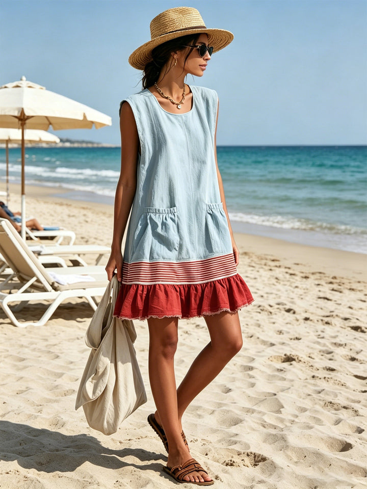 Versatile women's blue mini sundress. Features an effortless ruffle tiered hem, perfect for casual summer wear.