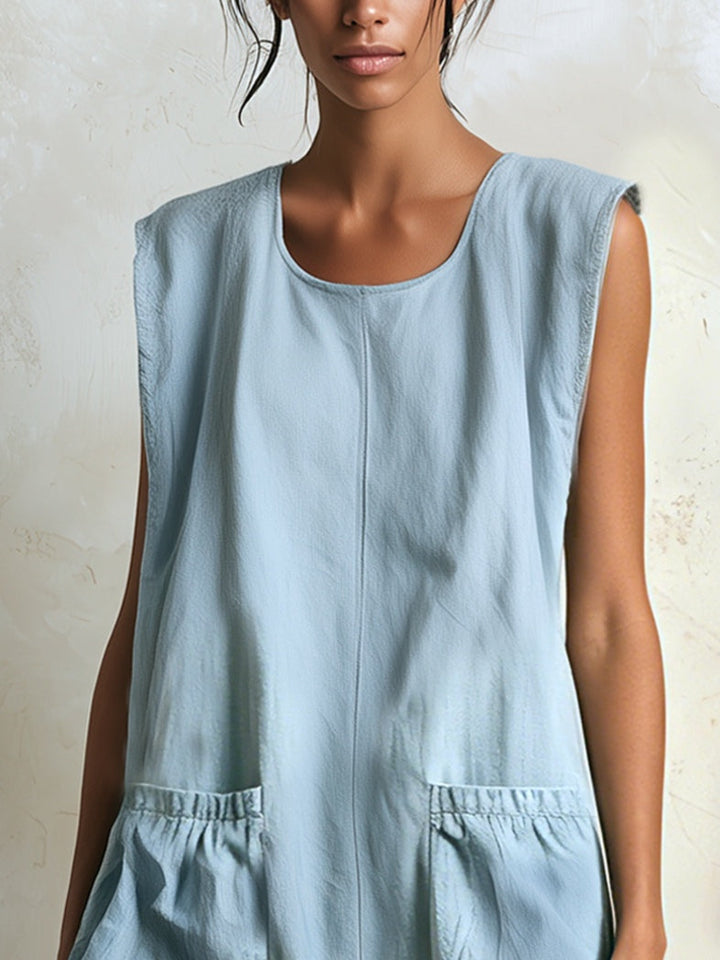 Effortless women's blue mini dress, shown on model. Features ruffle tiered contrast hem for casual summer look.