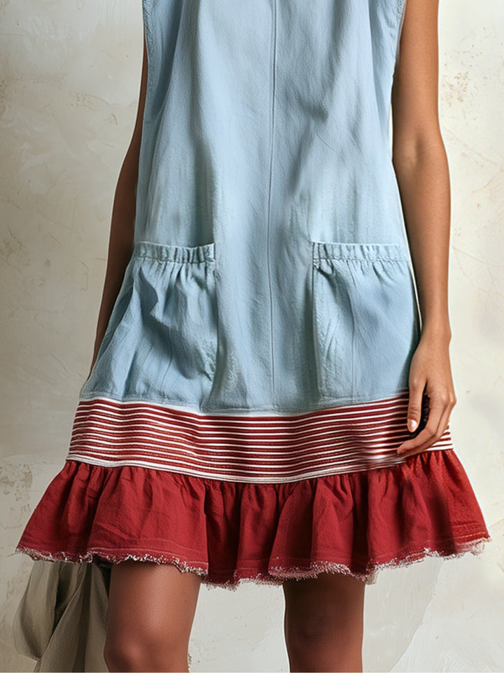 Flowy blue mini dress with a graceful ruffle tiered contrast hem. Perfect for effortless boho summer style.