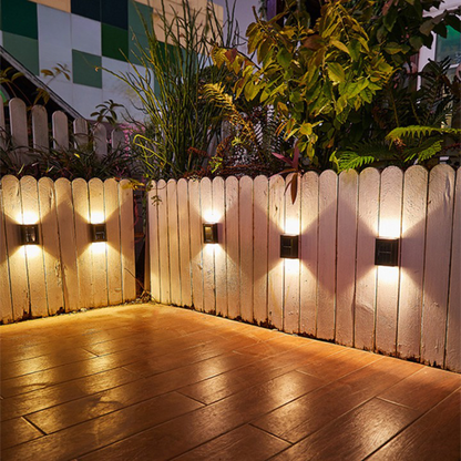 Solar LED wall lamps enhancing home security; ideal wireless outdoor lighting for patios, driveways & gardens.