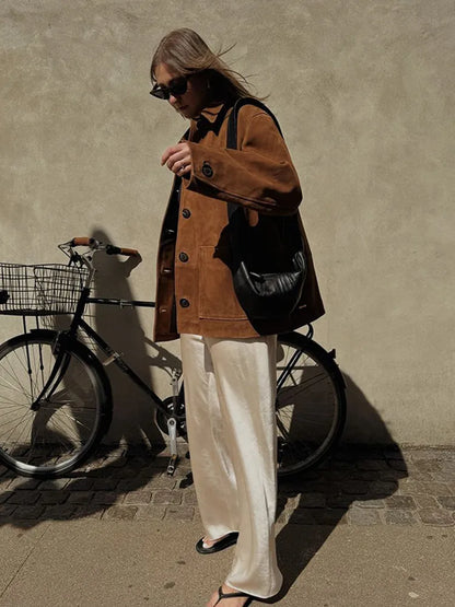 Stylish women's brown loose jacket, an essential piece of outerwear for seasonal versatility.