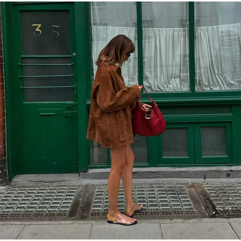 Comfortable brown loose-fit jacket for women, perfect for layering in transitional weather.