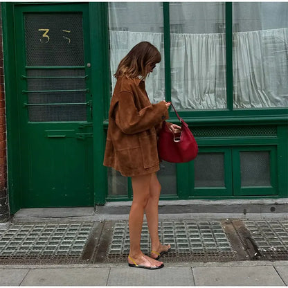 Comfortable brown loose-fit jacket for women, perfect for layering in transitional weather.