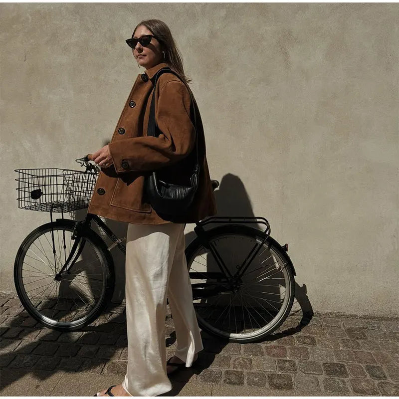 Chic women's brown outerwear, a loose jacket for effortless style in transitional and seasonal fashion.