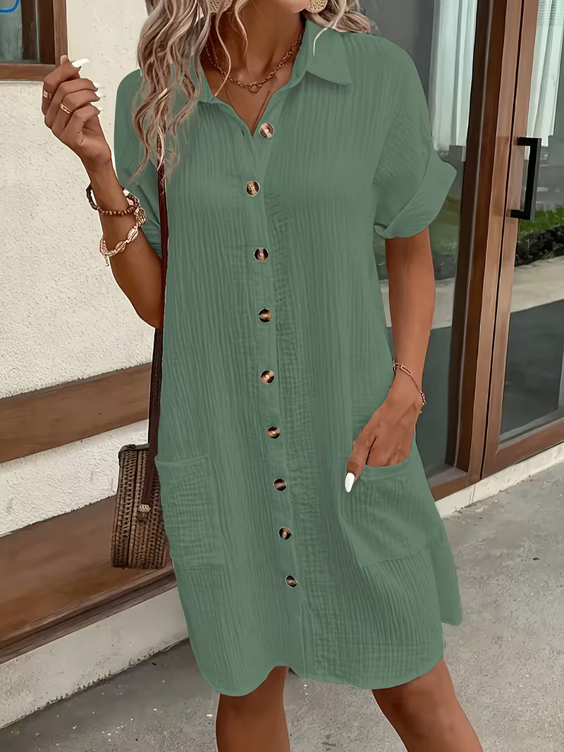 Women's button-front summer shirt dress. Easy fit, comfortable, and stylish for casual wear.