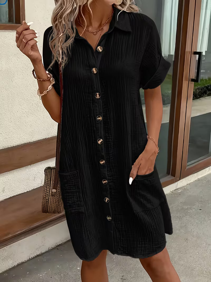 Comfortable women's button-front shirt dress. Easy fit, breezy fabric for stylish summer day wear.