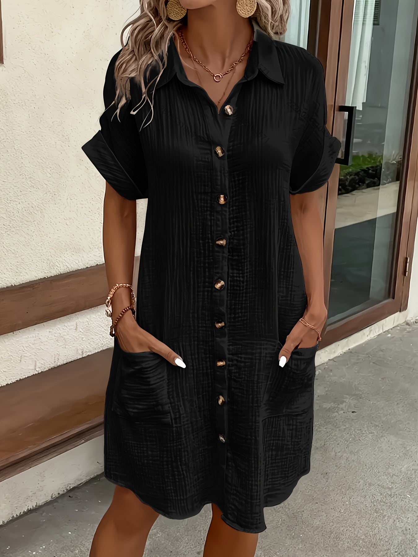 Chic women's button-front collared shirt dress. Ideal summer fashion with pockets for effortless style.