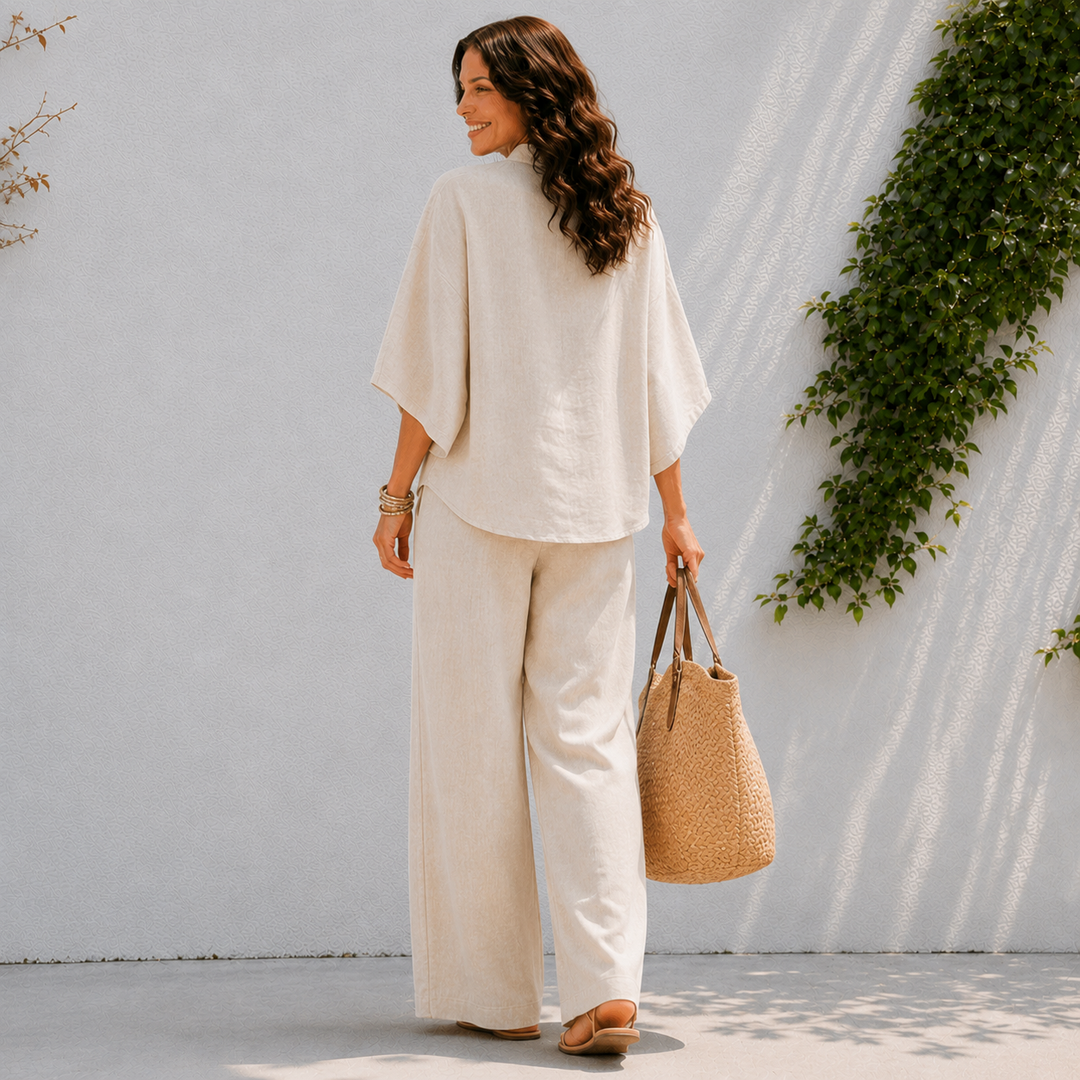 Relaxed fit women's two-piece set: oversized button-down blouse & wide leg pants. Ideal comfortable lounge wear.