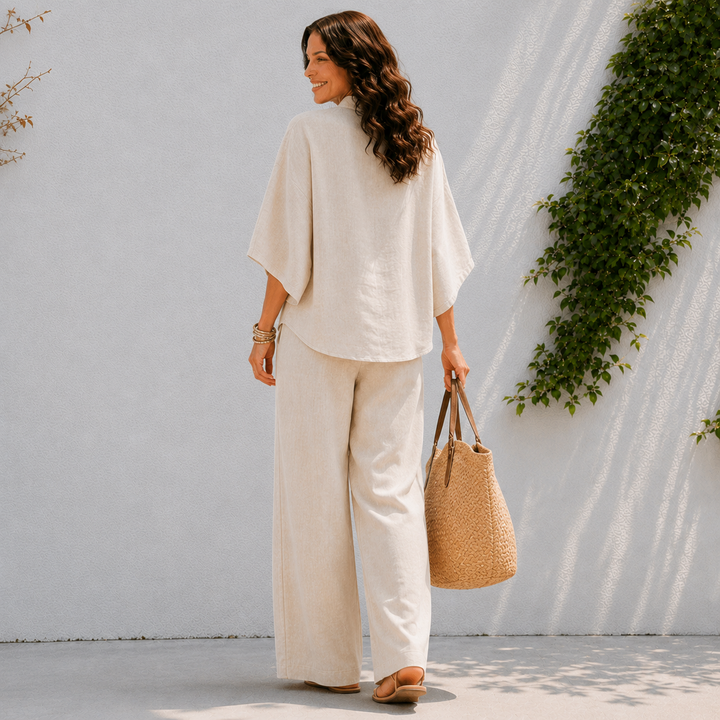 Relaxed fit women's two-piece set: oversized button-down blouse & wide leg pants. Ideal comfortable lounge wear.