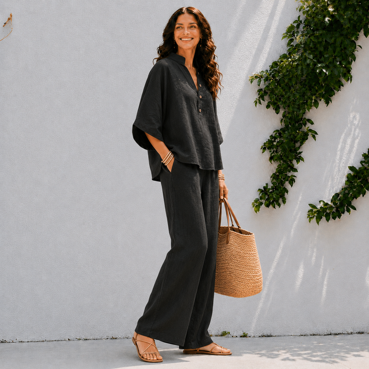 Comfortable women's two-piece set with a relaxed oversized blouse and flowing wide leg pants. Perfect for summer.
