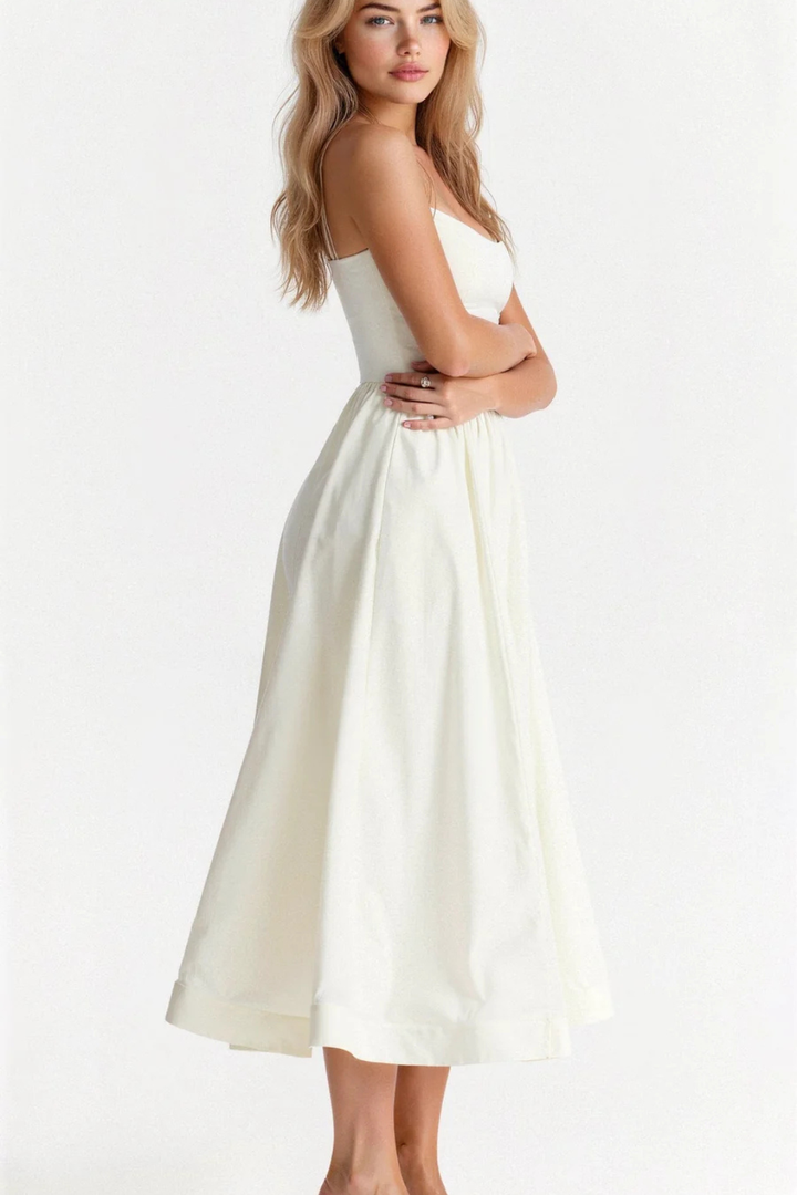 Effortless Women's Spaghetti Strap Midi Sundress. Versatile for casual day wear or elegant summer evenings.