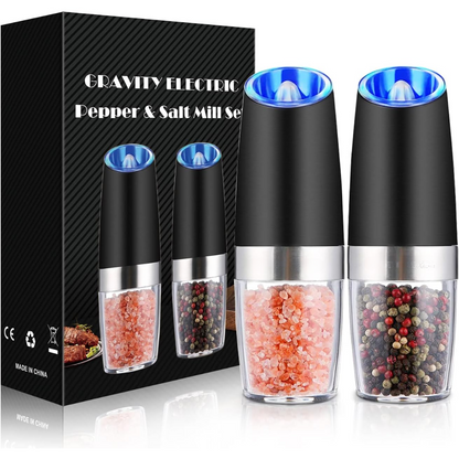 Cordless electric pepper grinder, modern stainless steel finish, rechargeable base included.
