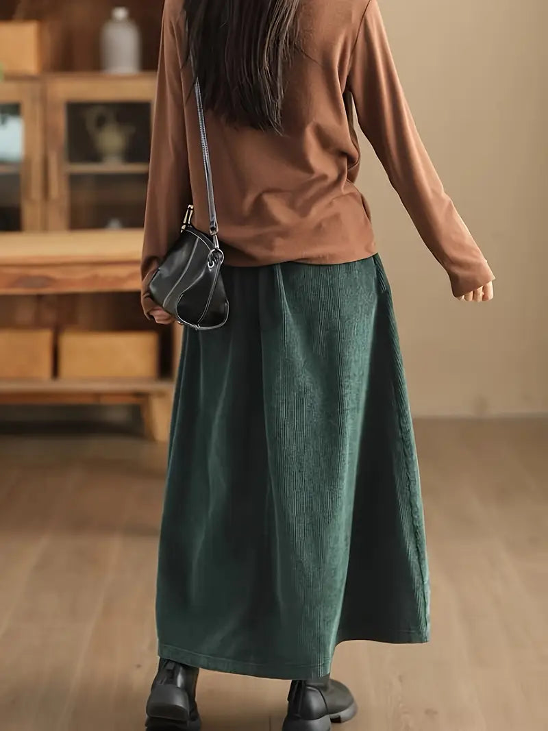 Women's long A-Line maxi skirt featuring a comfortable stretch waist and trendy corset lacing.