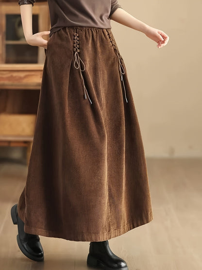 Versatile women's A-Line maxi skirt with elegant corset detail, suitable for casual & occasion wear.