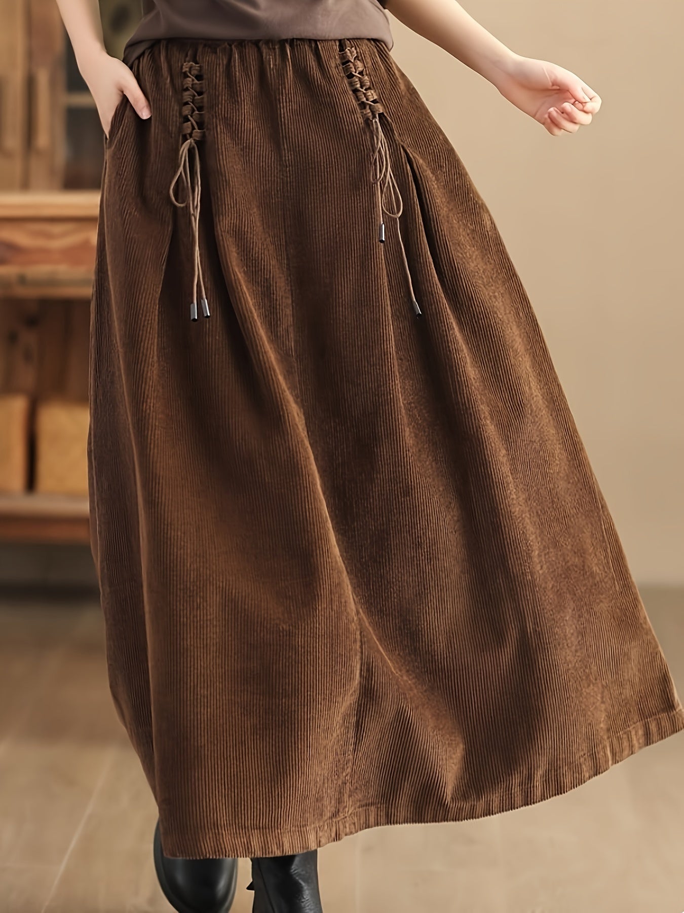 Fashionable women's A-Line maxi skirt with practical pockets & elegant corset detail for any event.