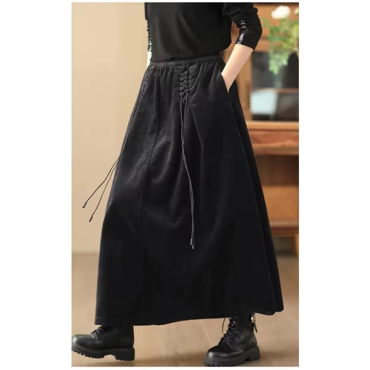 Stylish women's A-line maxi skirt, stretch waist, pockets, and elegant corset detail for modern fashion.