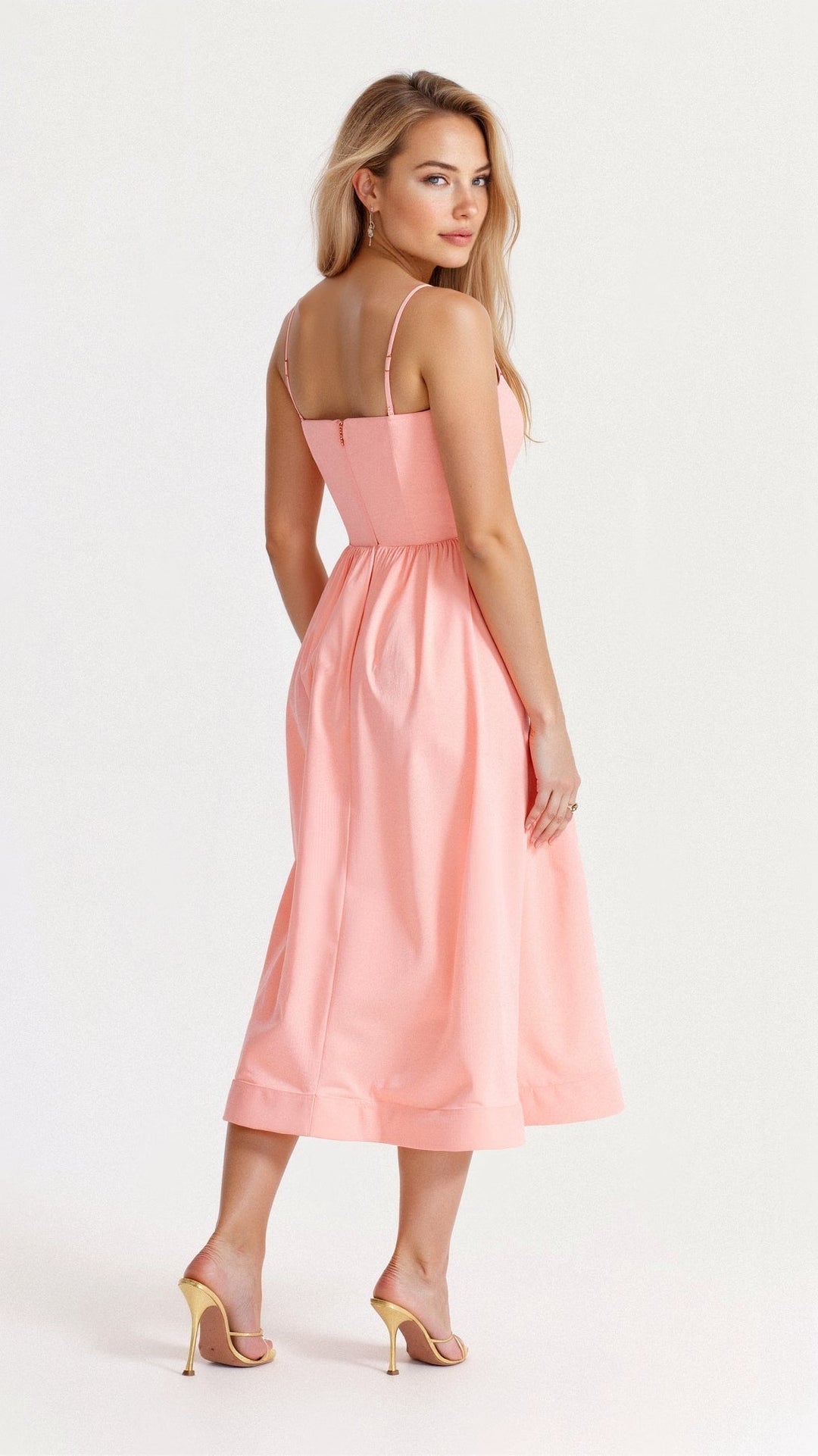 Feminine A-line midi dress with spaghetti straps for women, an elegant statement for any spring or summer event.
