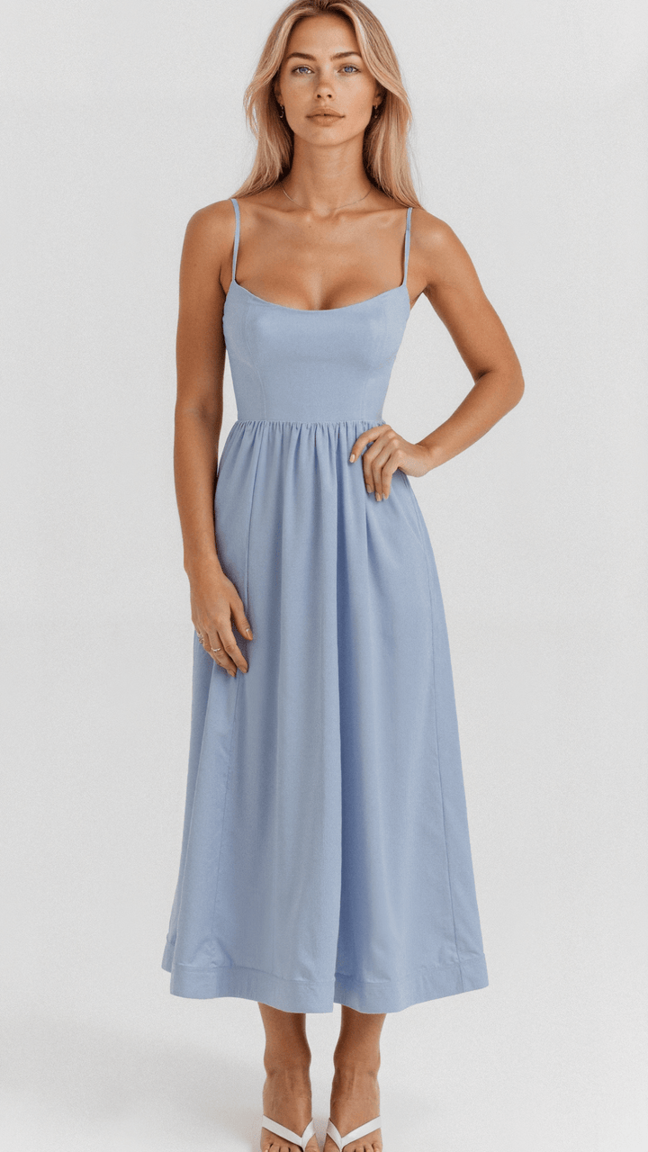 Flowing women's A-line midi dress with thin spaghetti straps, an elegant choice for special occasions.