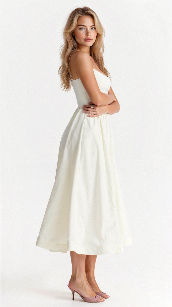 Stylish women's A-line midi dress, spaghetti strap design. Elegant for spring fashion & versatile wear.