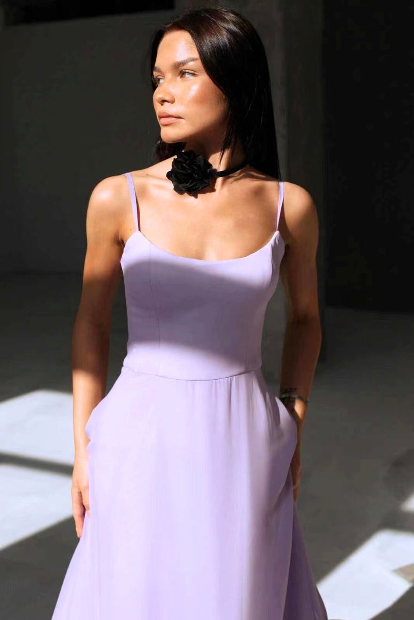 Summer A-line sleeveless twirl dress for women. Elegant wedding guest or cocktail party outfit, flowing style.