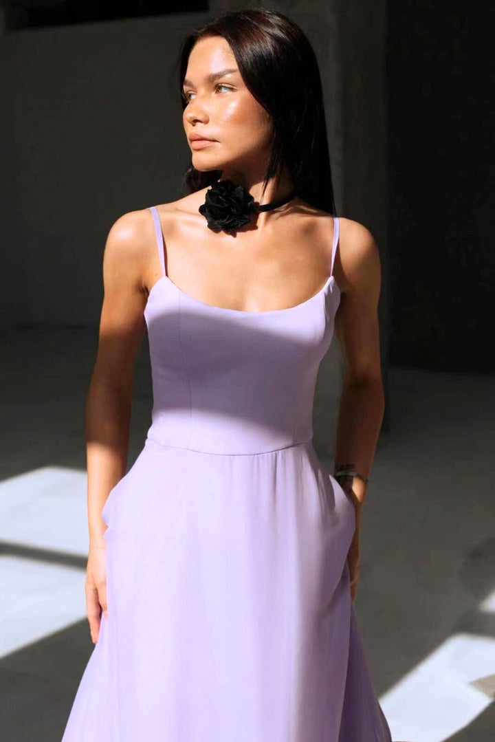 Summer A-line sleeveless twirl dress for women. Elegant wedding guest or cocktail party outfit, flowing style.