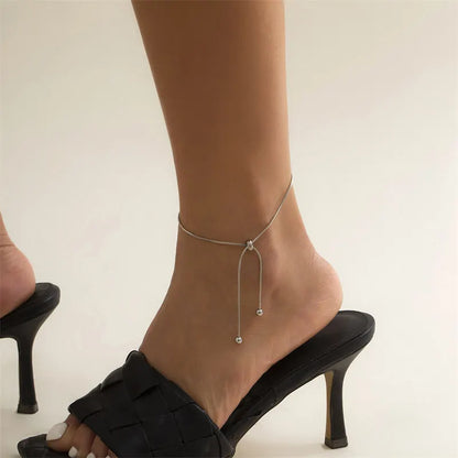 Chic gold and silver adjustable chain anklet, a delicate and elegant accessory for any occasion.