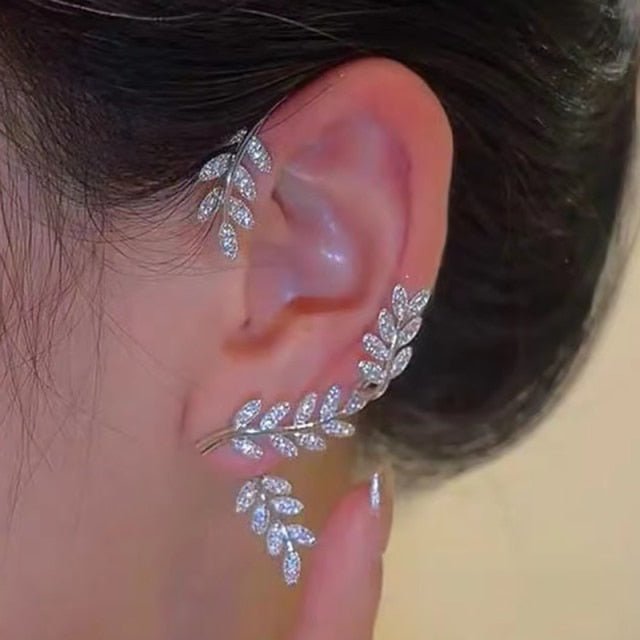 Gold tone elegant leaf clip on earrings for non-pierced ears. Adjustable and comfortable women's fashion.