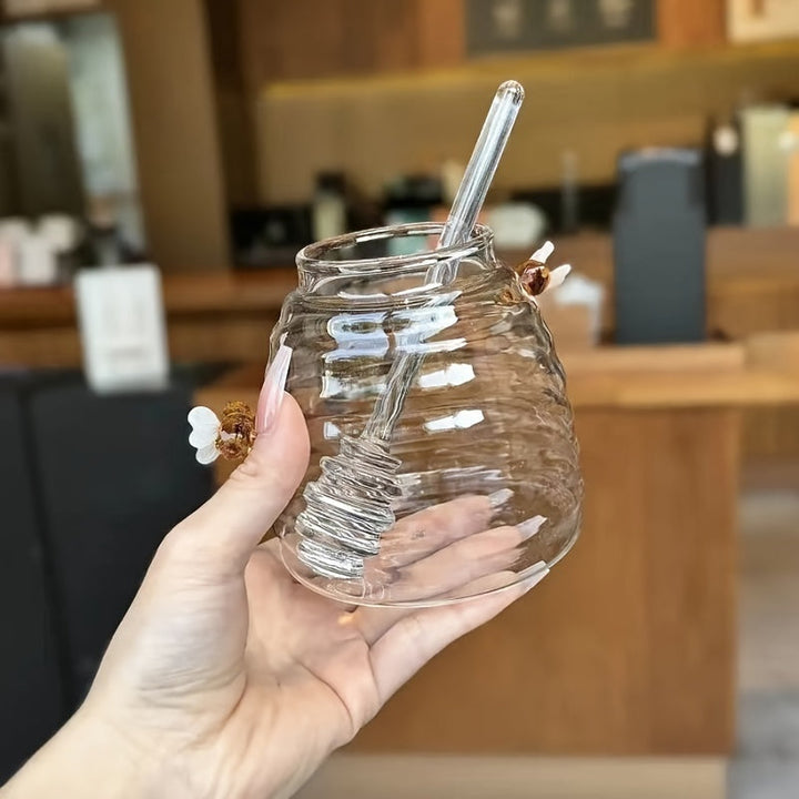 Borosilicate glass beehive honey jar with integrated dipper, a chic serving ware.