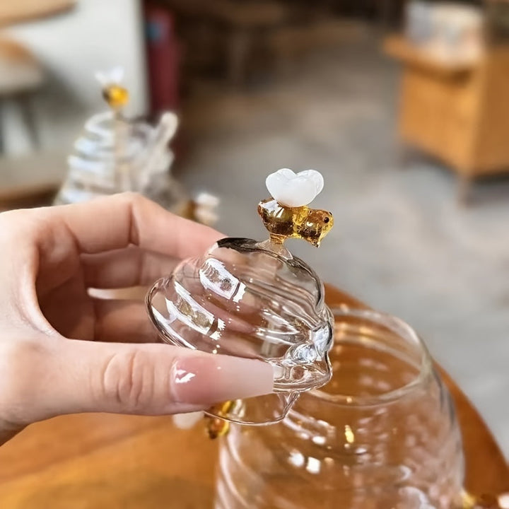 Decorative beehive glass honey jar, perfect for kitchen countertop display.