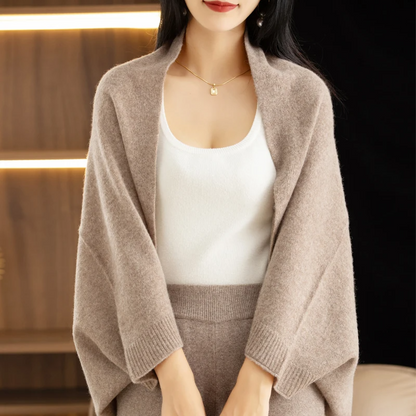 Elegant beige women's versatile shawl, a comfortable multi-way wrap for any occasion.
