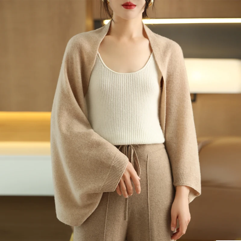 Cozy grey multi-way women's shawl wrap, a versatile and comfortable fashion accessory.