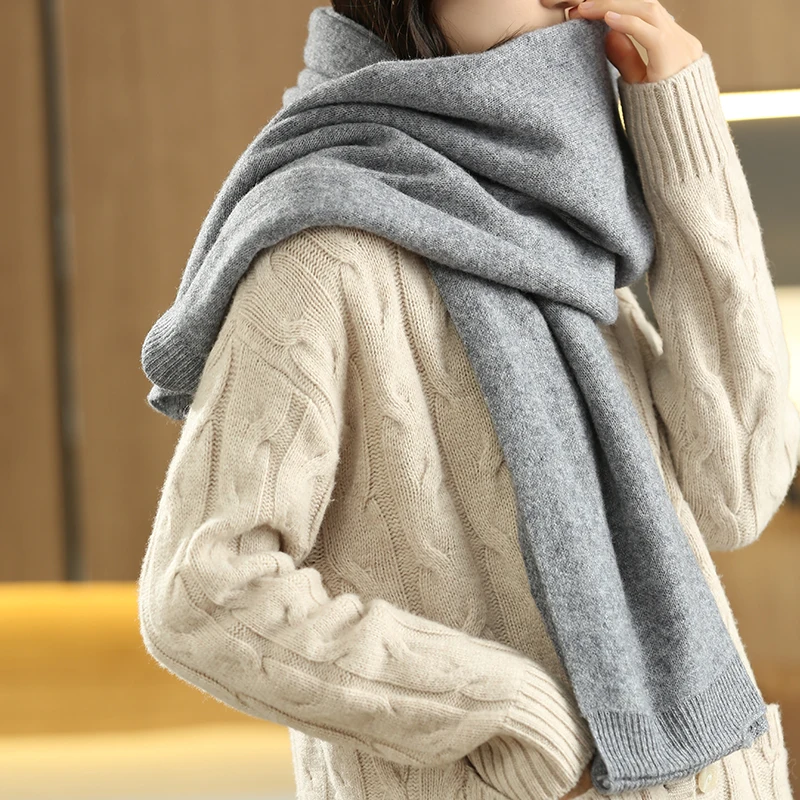 Fashionable women's multi-way shawl wrap, offering versatile style and cozy comfort.