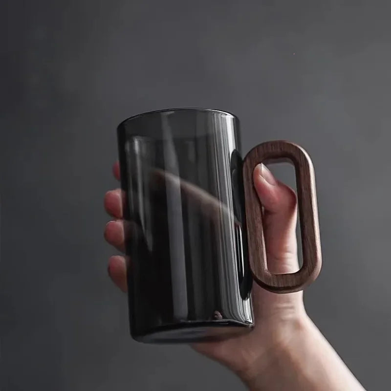 Unique black borosilicate glass features a rich walnut handle. Ideal for sophisticated drinks, home decor, and gifts.