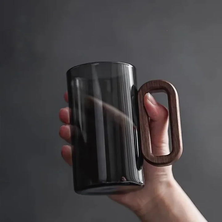 Unique black borosilicate glass features a rich walnut handle. Ideal for sophisticated drinks, home decor, and gifts.