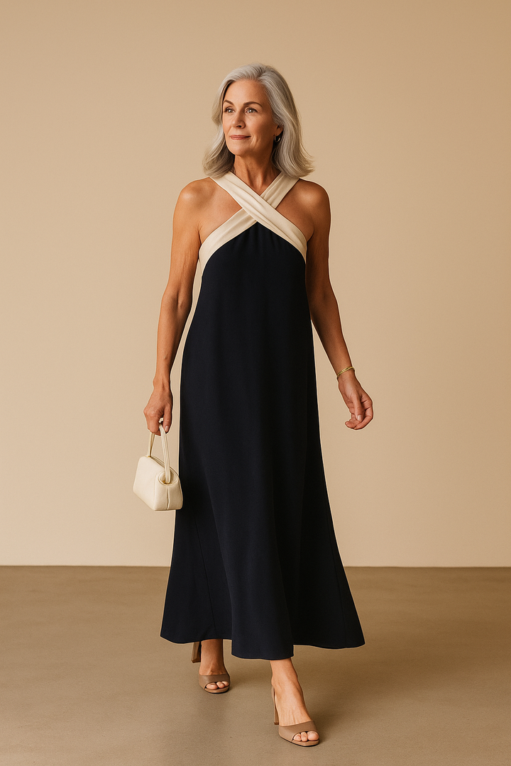 Elegant black cross-neck A-line summer dress for women, perfect for vacation or casual wear. Breezy & stylish.