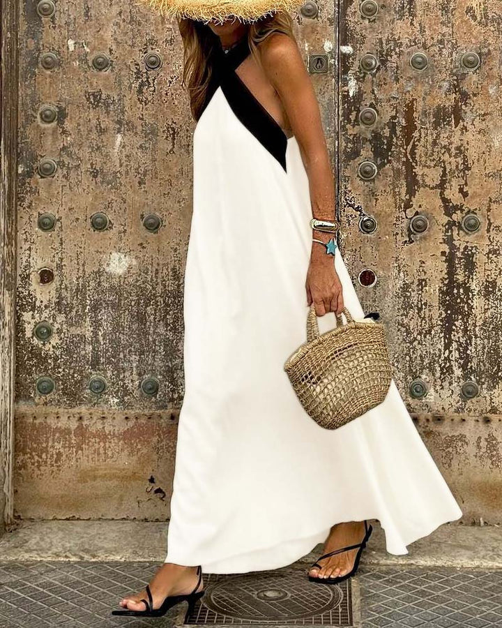 Stylish elegant white cross-neck summer dress, perfect A-line casual wear or beach dress for women.
