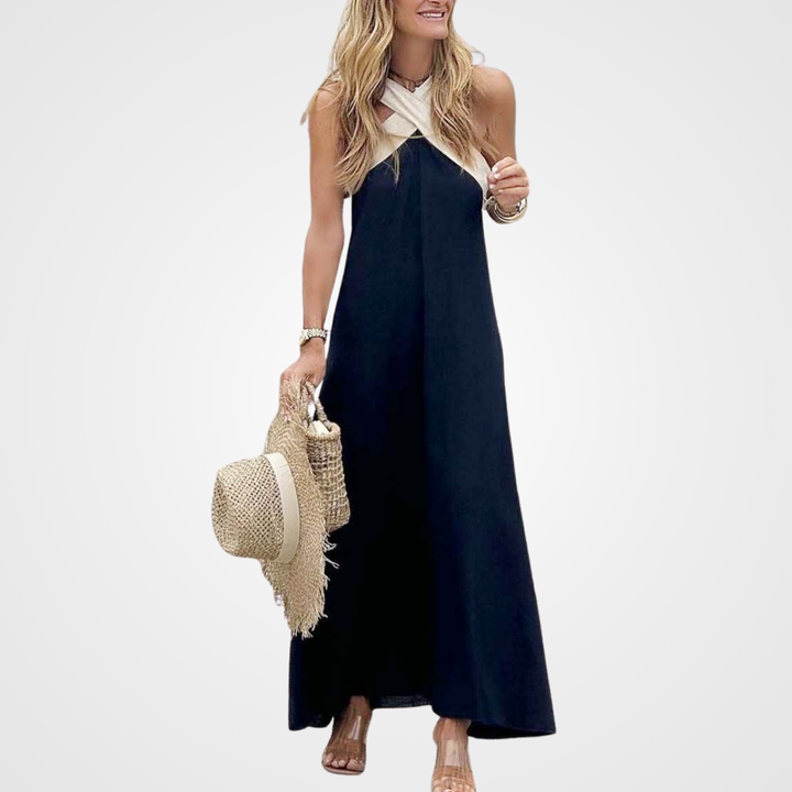 Comfy white sleeveless cross-neck summer dress, ideal for beach days or stylish casual women's fashion.