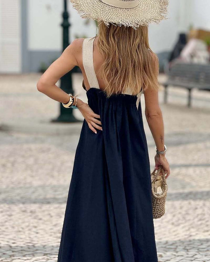 White elegant cross-neck summer dress for women. A breezy A-line design, perfect as a casual beach dress.