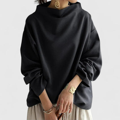Versatile blue high-neck long-sleeve women's top. Sophisticated and comfortable classic style for modern women.