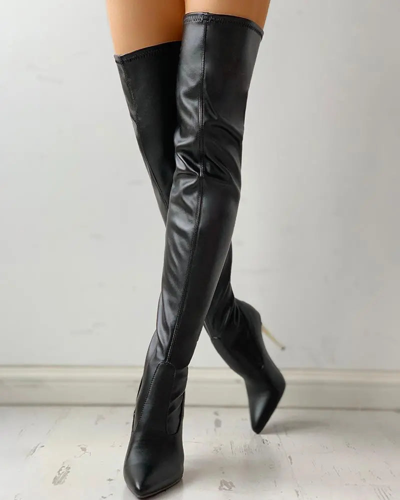 Elegant black knee-high boots for women with a comfortable low heel and convenient zip-up closure, perfect for everyday wear.