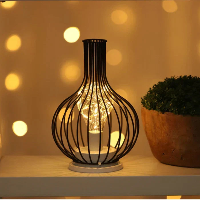 Sophisticated modern table lamp, black finish. Perfect accent lighting to elevate your home decor.