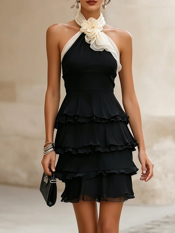 Elegant black rosette mini cocktail dress with halter neckline and ruffle skirt for women's evening wear.