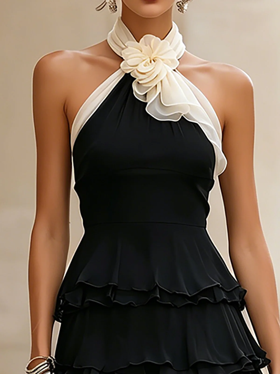 Women's black mini cocktail dress featuring a chic rosette detail, perfect for parties & special occasions.