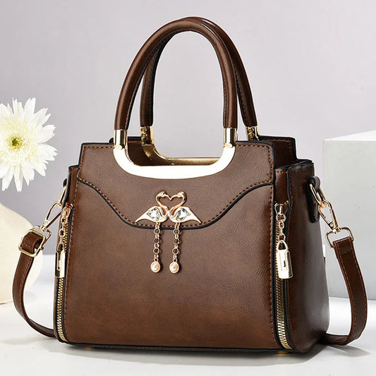 Elegant black structured handbag for women, versatile fashion accessory.