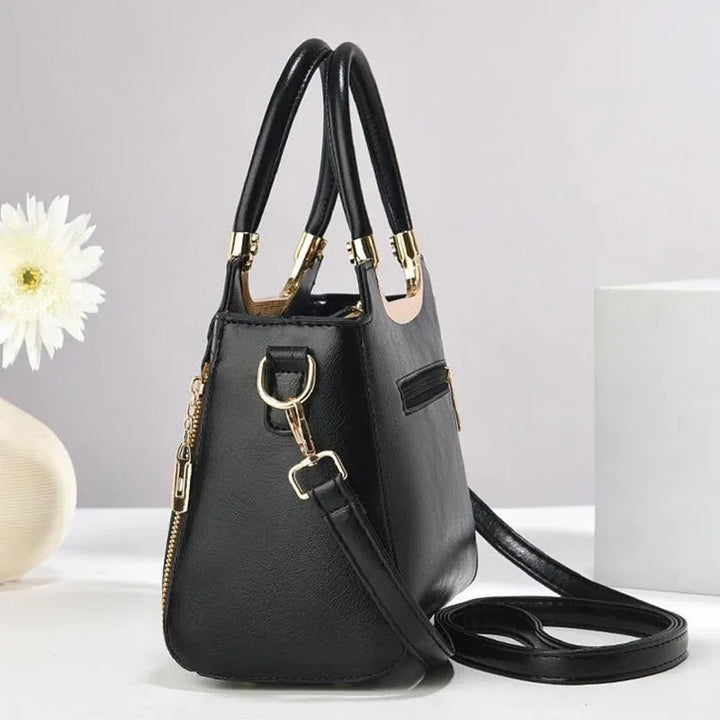 Structured brown women's shoulder bag, elegant & versatile crossbody purse.